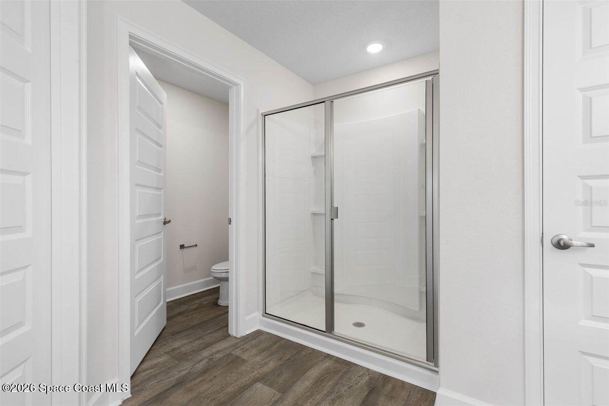 962 Seneca Avenue Sebastian, FL 32958 - Photo 18 of 28 a bathroom with a glass shower door