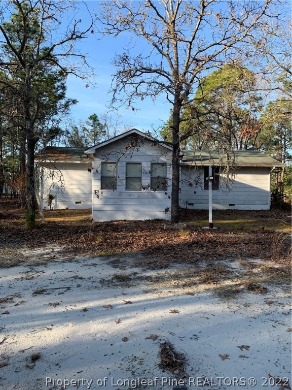 1231 Loop Road Raeford, NC 28376 - Photo 2 of 11 a view of a house with a yard