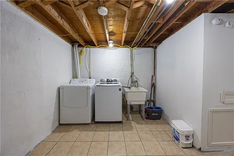a view of a storage & utility room with washer and dryer