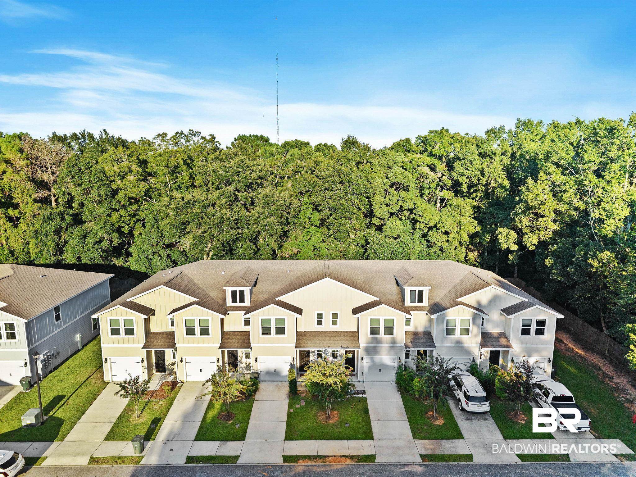 25806 Pollard Road, Unit 24 Daphne, AL 36526 - Photo 3 of 33 View from above of property featuring a heavily wooded area