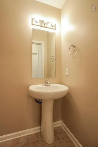 a bathroom with a sink and mirror