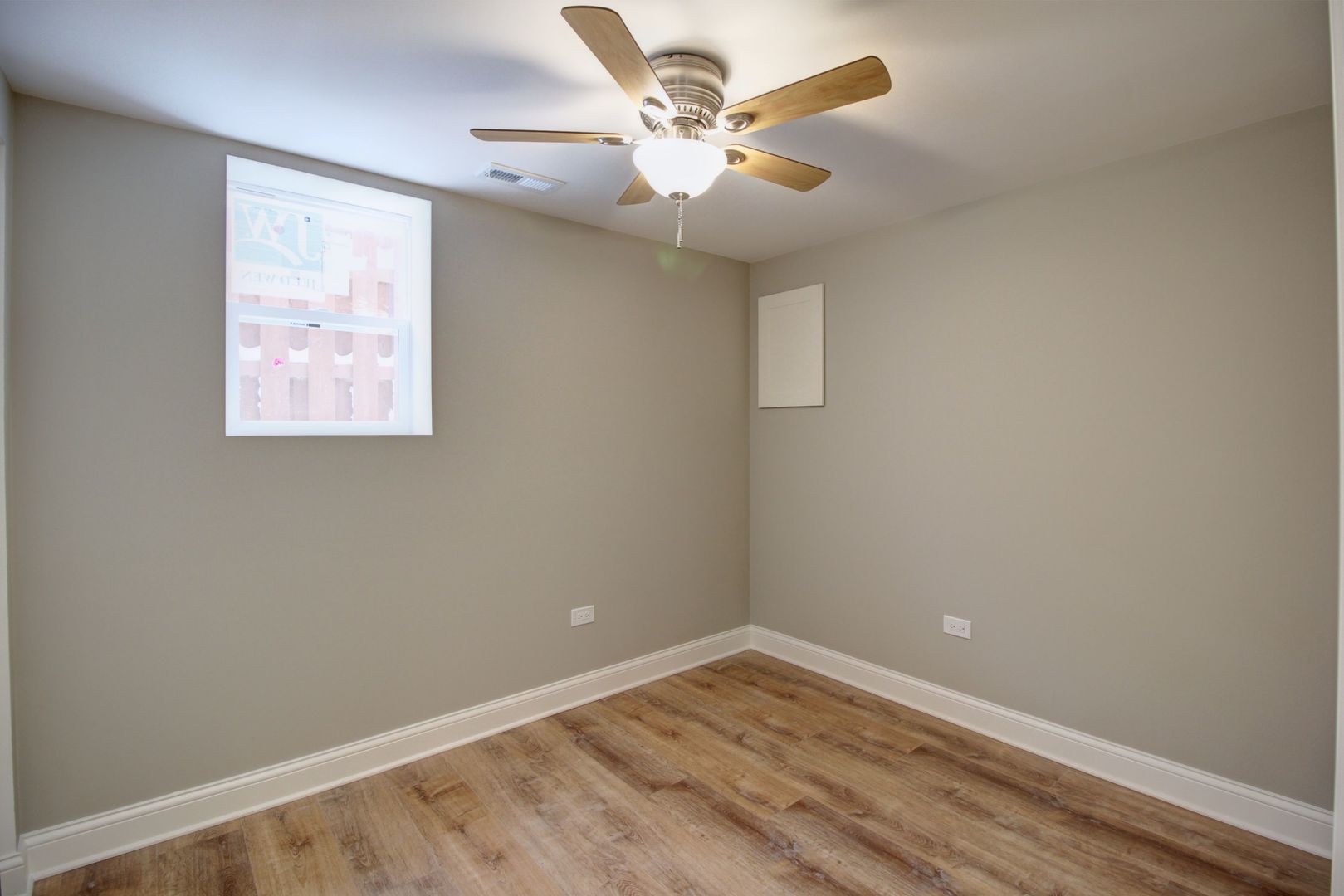 225 Haller Avenue Romeoville, IL 60446 - Photo 12 of 19 an empty room with a window and a ceiling fan