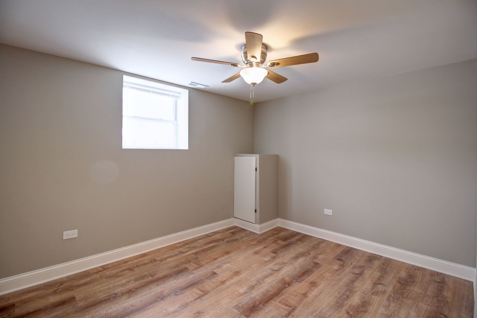 225 Haller Avenue Romeoville, IL 60446 - Photo 13 of 19 an empty room with wooden floor and fan