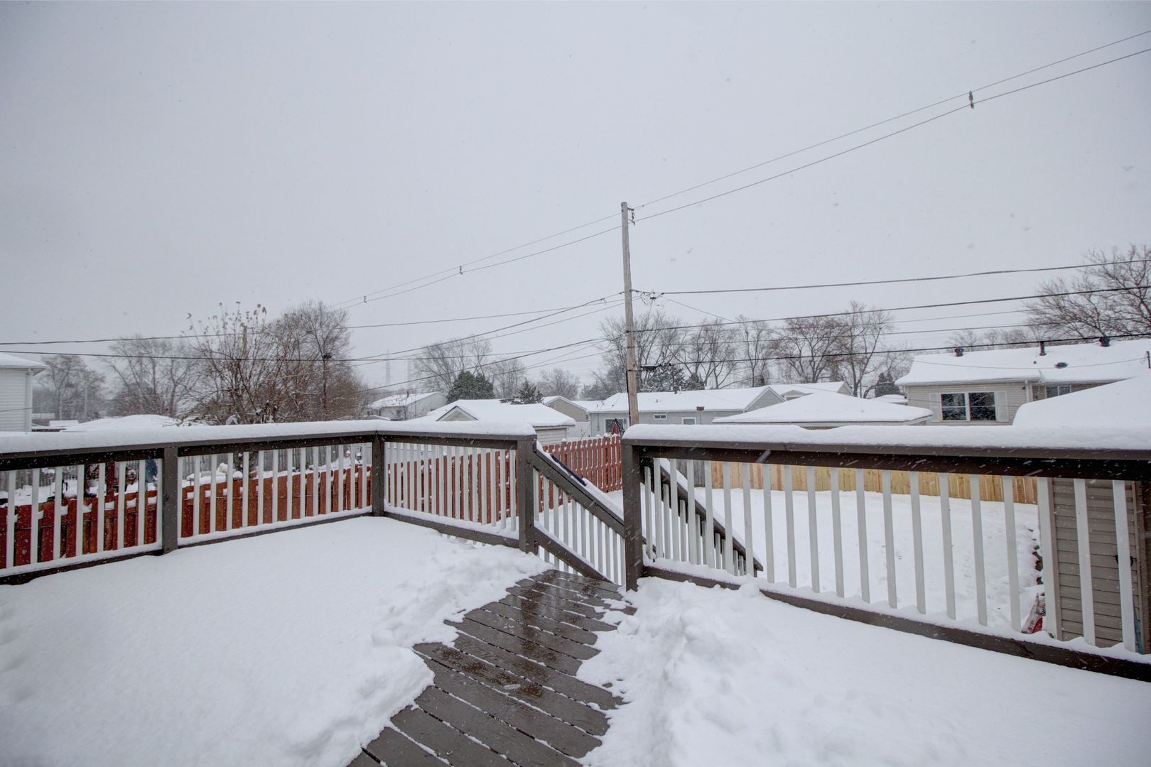 225 Haller Avenue Romeoville, IL 60446 - Photo 18 of 19 a view of a balcony with wooden floor