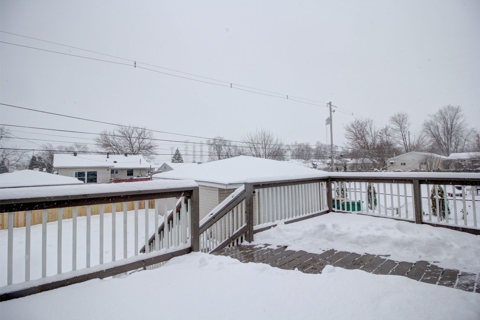 225 Haller Avenue Romeoville, IL 60446 - Photo 19 of 19 a view of a balcony that has a table and chairs