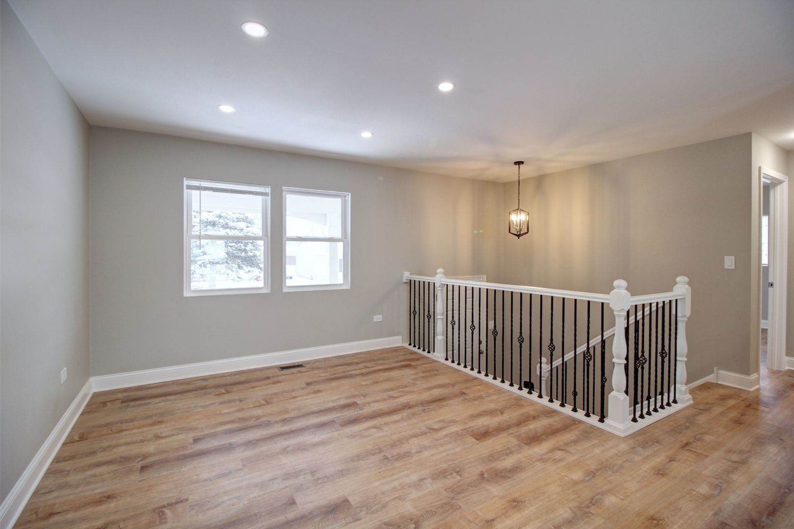 225 Haller Avenue Romeoville, IL 60446 - Photo 2 of 19 a view of an empty room with wooden floor and a window