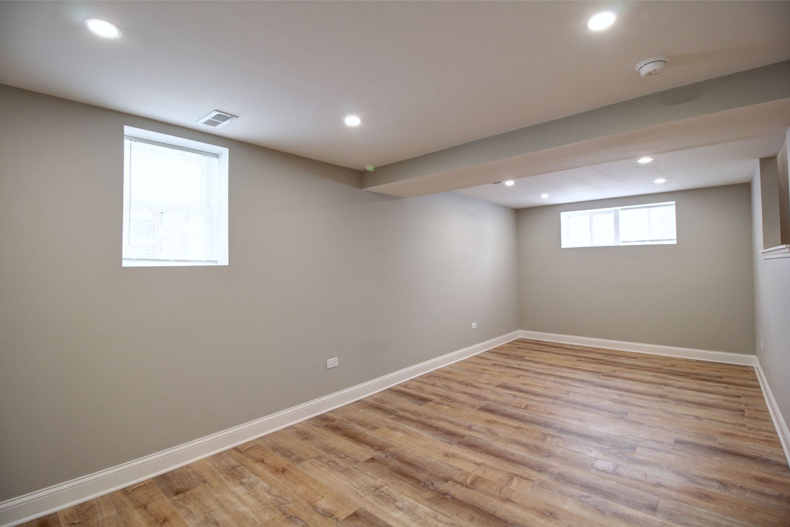 225 Haller Avenue Romeoville, IL 60446 - Photo 8 of 19 an empty room with wooden floor and windows
