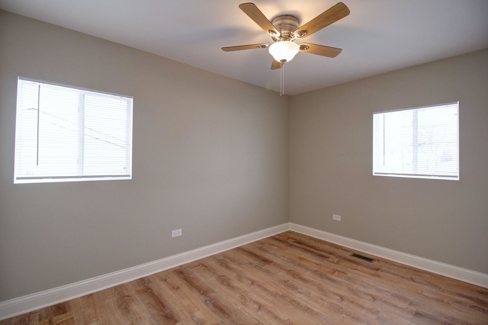 225 Haller Avenue Romeoville, IL 60446 - Photo 9 of 19 an empty room with a window and a fan