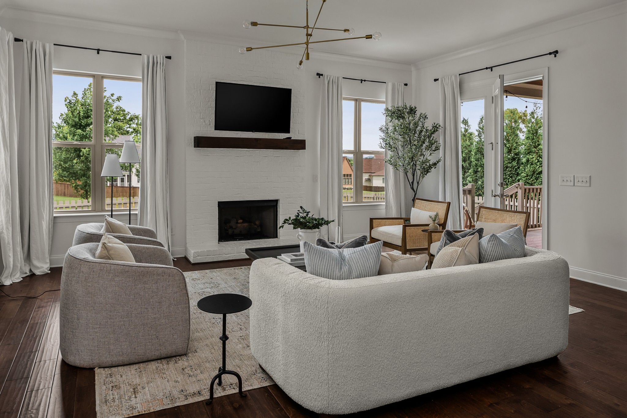 449 River Bluff Drive Franklin, TN 37064 - Photo 24 of 51 a living room with furniture a flat screen tv and a fireplace