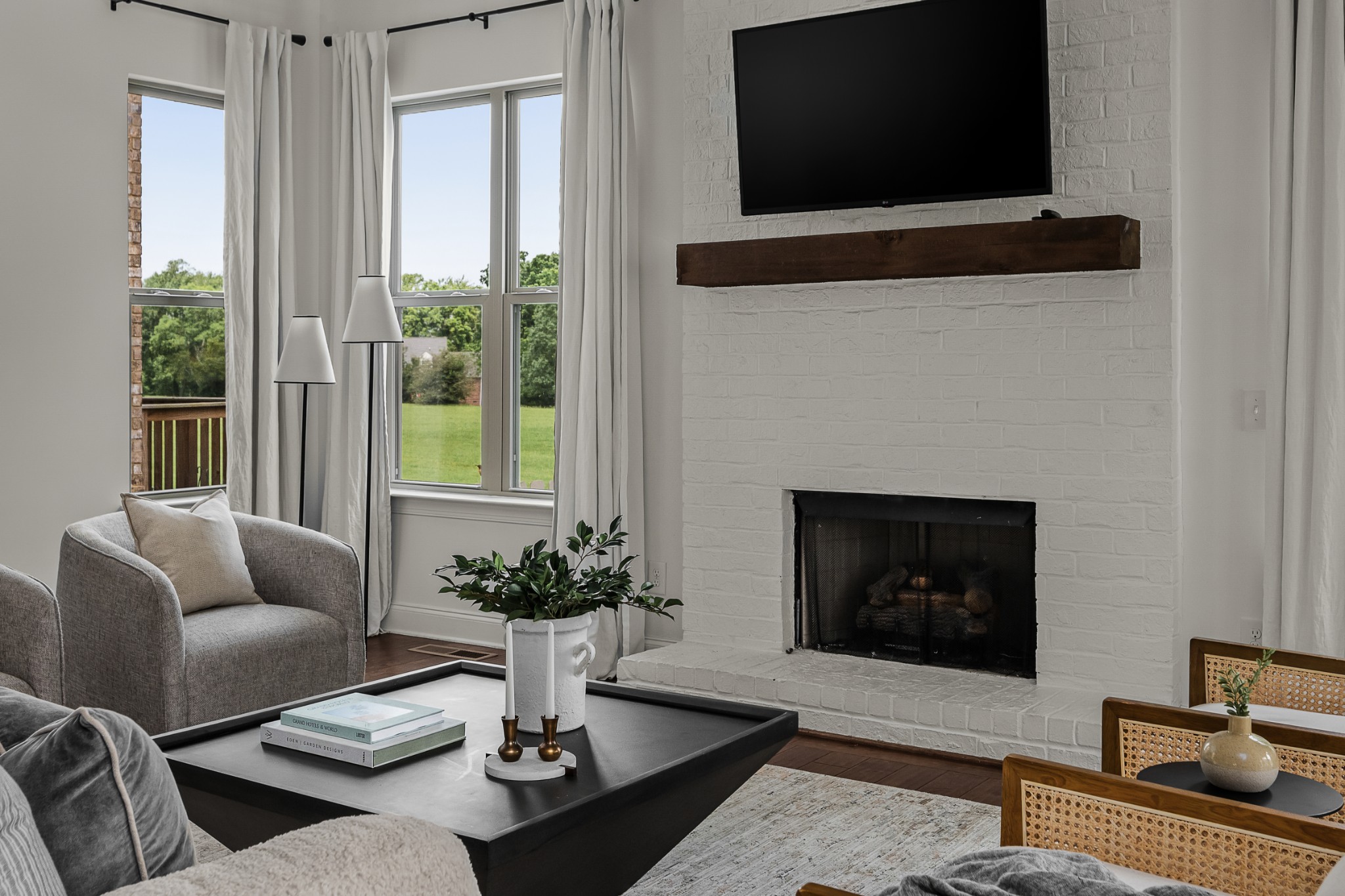 449 River Bluff Drive Franklin, TN 37064 - Photo 26 of 51 a living room with furniture a flat screen tv and a fireplace