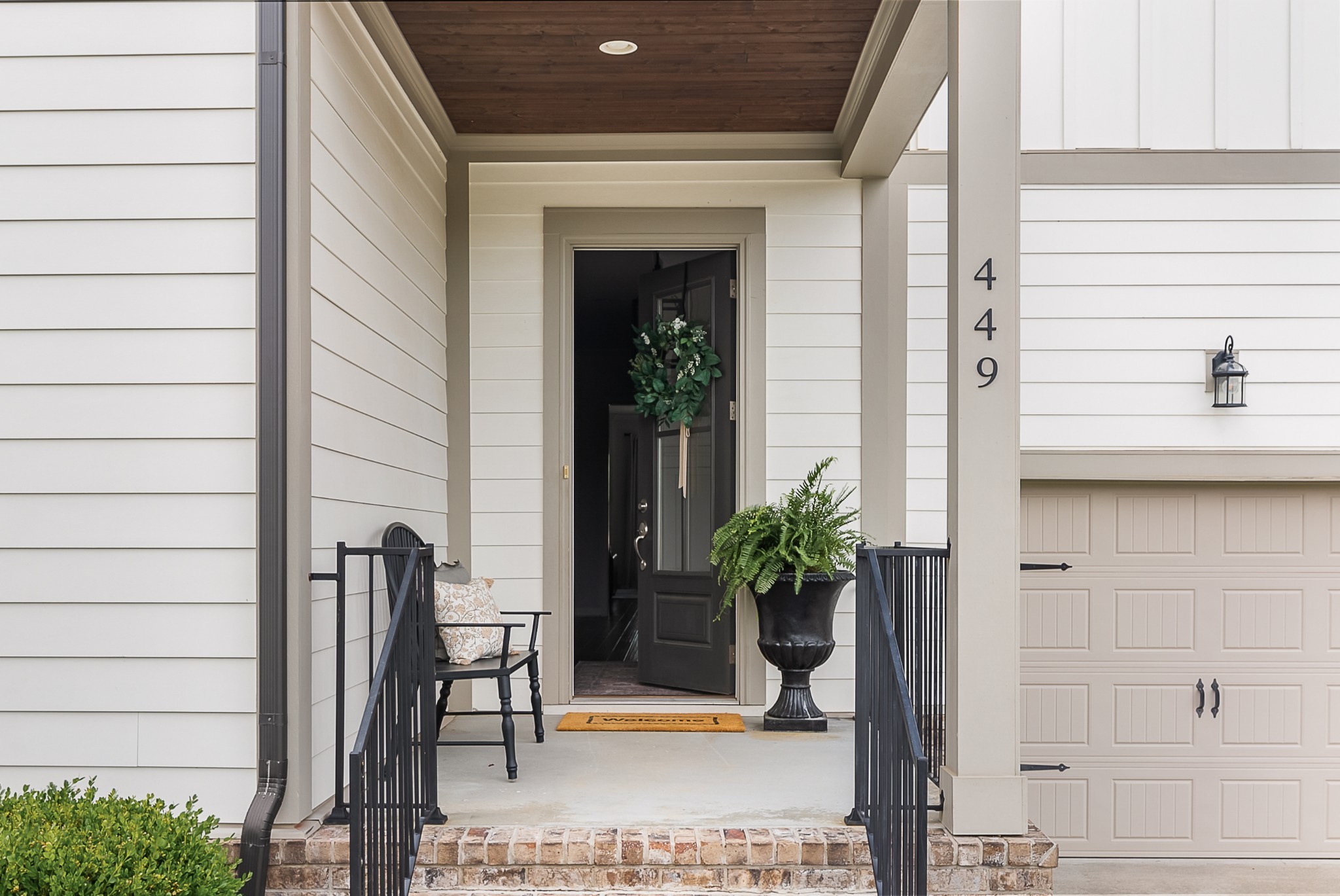 449 River Bluff Drive Franklin, TN 37064 - Photo 3 of 51 a potted plant sitting in front of a door