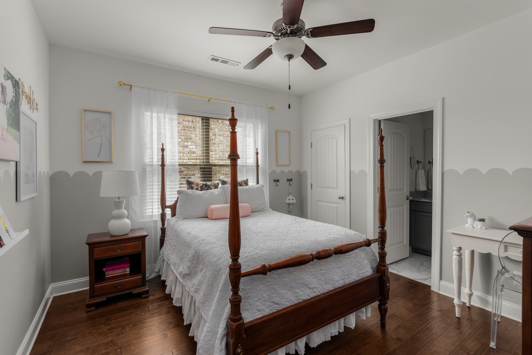 449 River Bluff Drive Franklin, TN 37064 - Photo 40 of 51 a bedroom with a bed a table and wooden floor