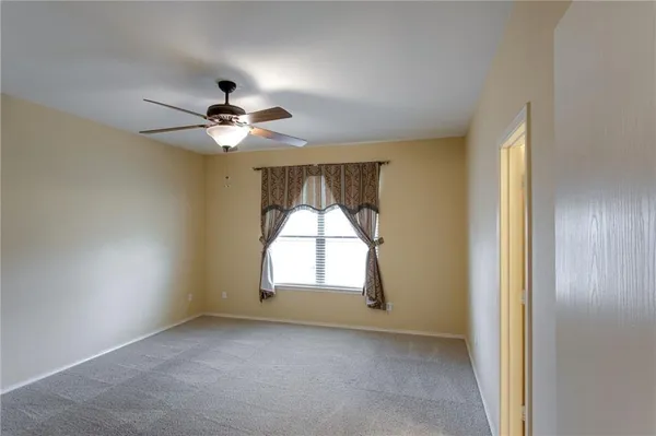 a kitchen view with stainless steel appliances granite countertop a refrigerator a stove a microwave oven a sink with island and wooden floor