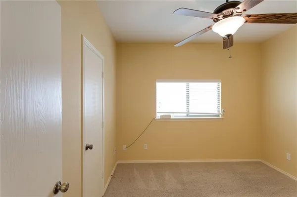 a bathroom with a shower and a toilet