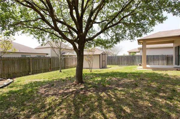 a house with a tree in front of it