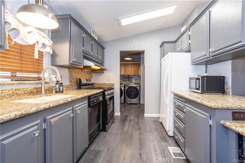 30090 Briggs Road Agua Dulce, CA 91390 - Photo 7 of 23 a kitchen with stainless steel appliances granite countertop a sink and a stove