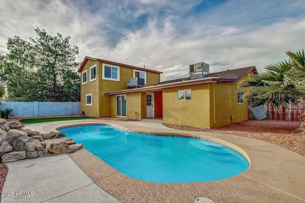 a front view of house with yard outdoor seating and barbeque oven