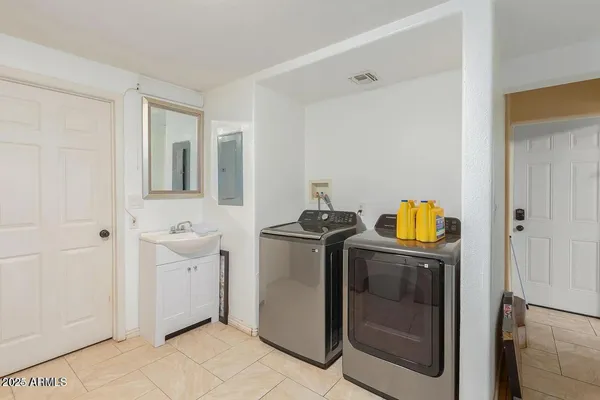 a utility room with dryer and washer