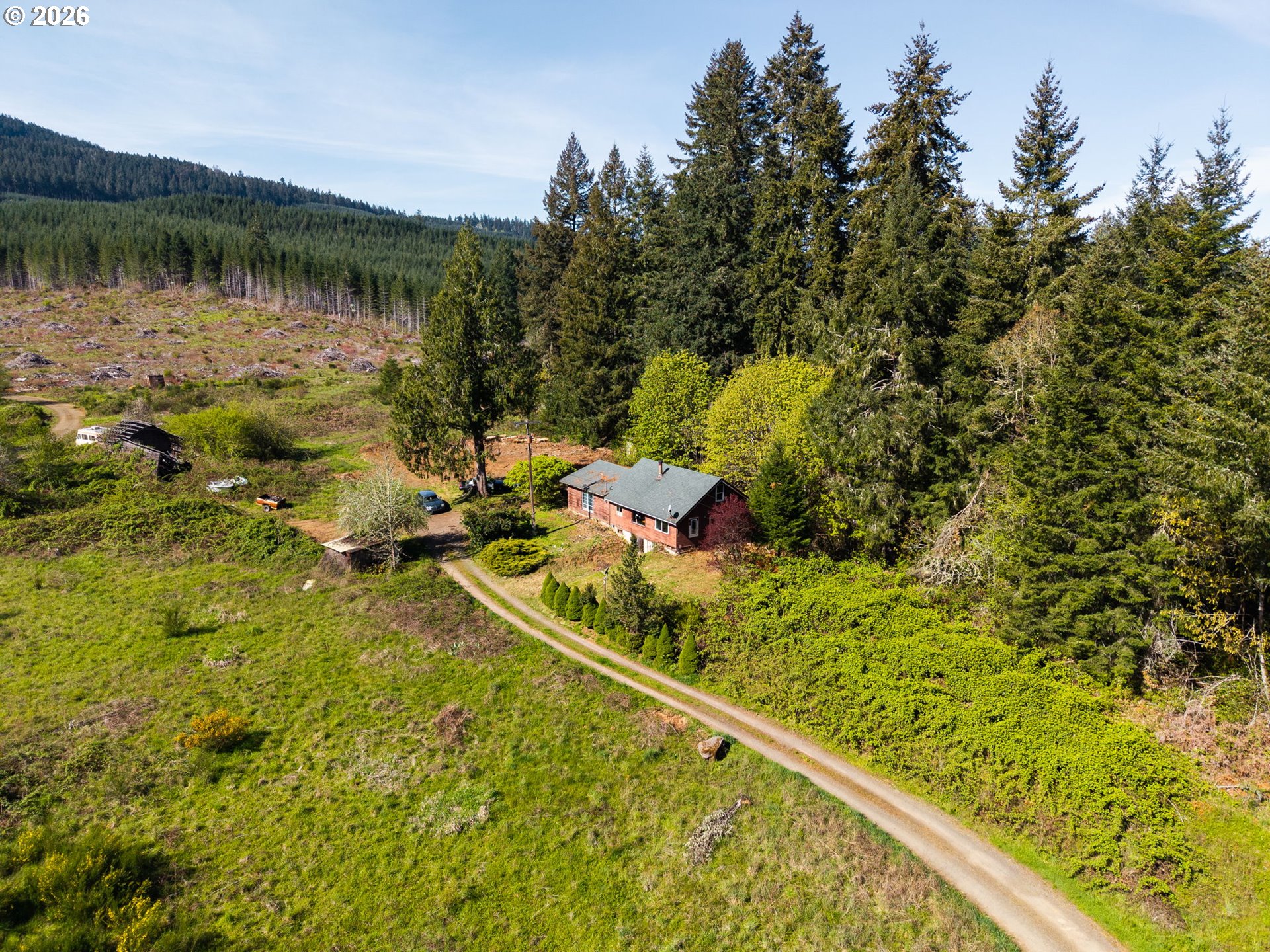 21542 Highway 126 Noti, OR 97461 - Photo 2 of 22 a view of a lake with a houses