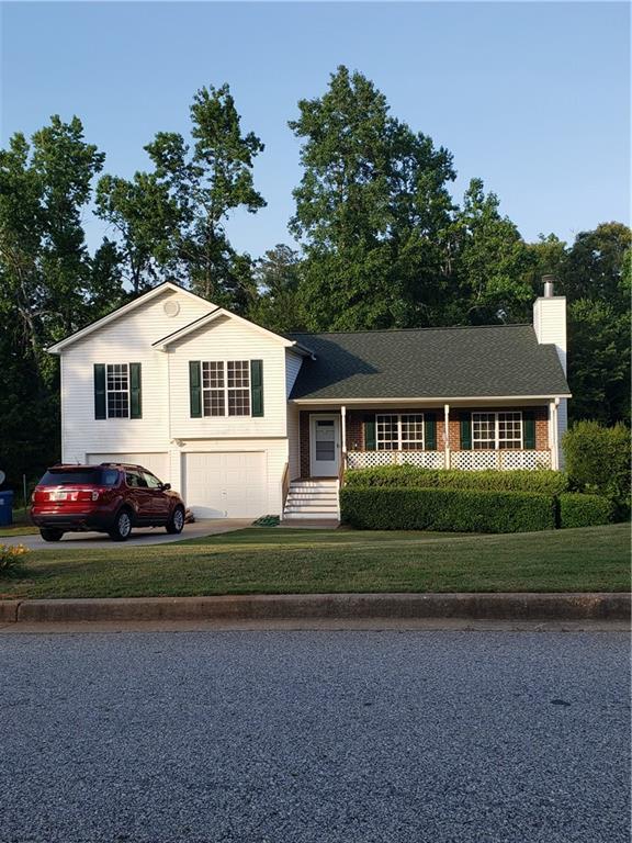 Beautiful home with manicured landscaping and an inviting front porch.