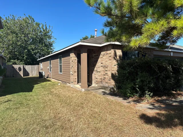 a backyard of a house with lots of green space