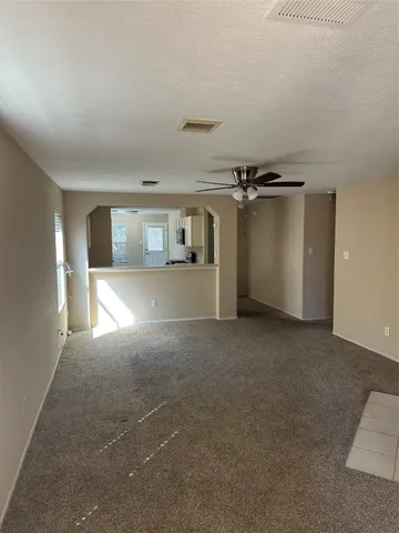 a view of a big room with closet and windows