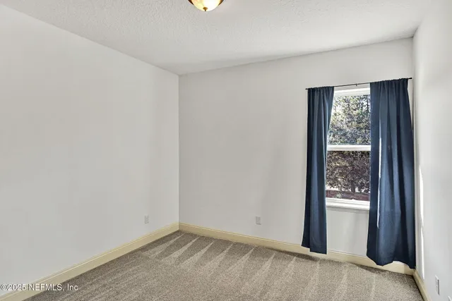 a view of an empty room with window