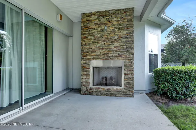 a view of an empty room and fire place
