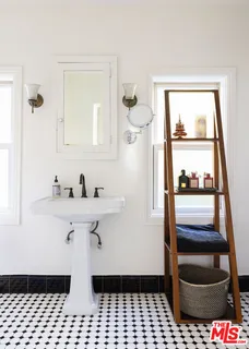 a bathroom with a sink a toilet and vanity