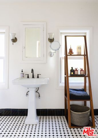 a bathroom with a sink a toilet and vanity
