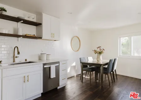 a view of a vase of flowers sitting on a table