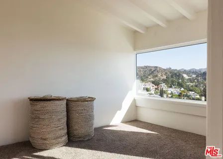 a bathroom with a sink a mirror and a shower
