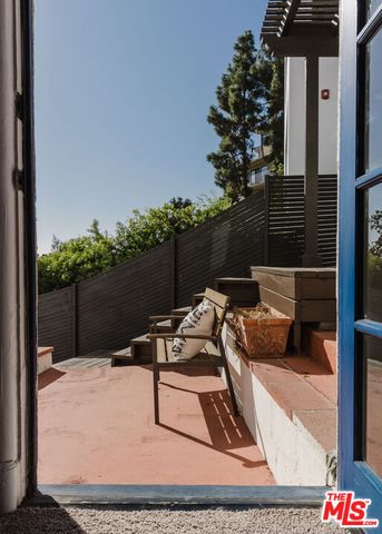 a terrace of a house with outdoor seating