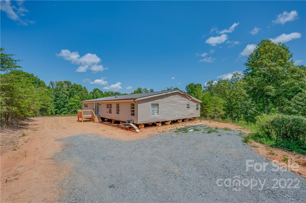546 West V Thompson Road Rutherfordton, NC 28139 - Photo 3 of 17 a house with trees in the background