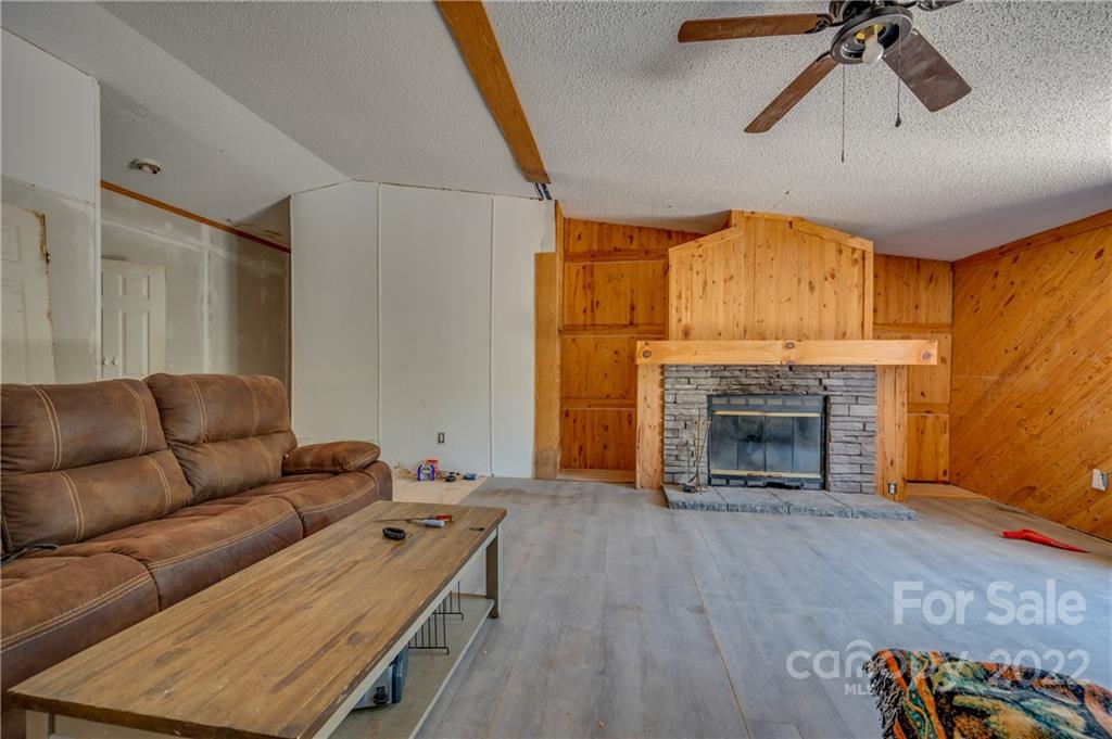 546 West V Thompson Road Rutherfordton, NC 28139 - Photo 7 of 17 a living room with furniture and a fireplace