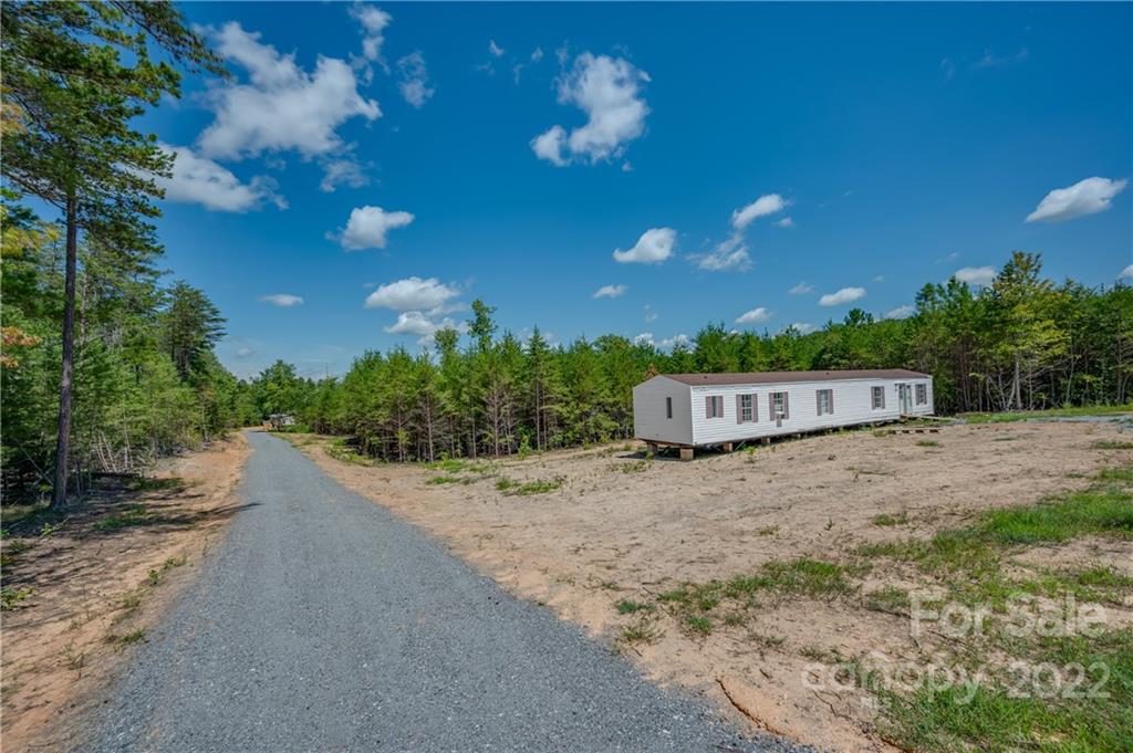 546 West V Thompson Road Rutherfordton, NC 28139 - Photo 8 of 17 a backyard of a house with a yard and outdoor seating