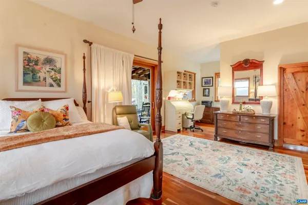 a bed room with a bed and a chair