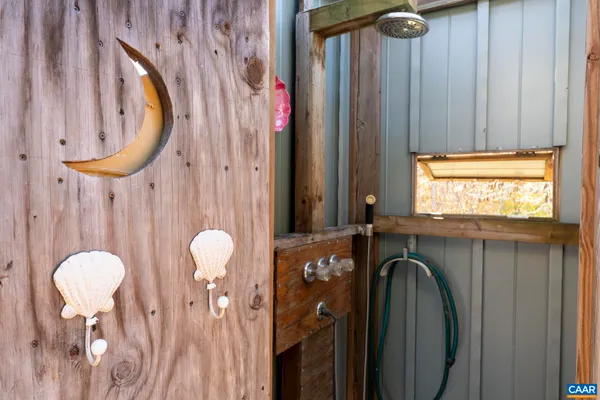 a backyard of a house with table and chairs