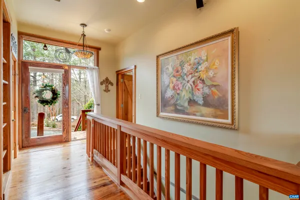 a living room with furniture a fireplace and a large window