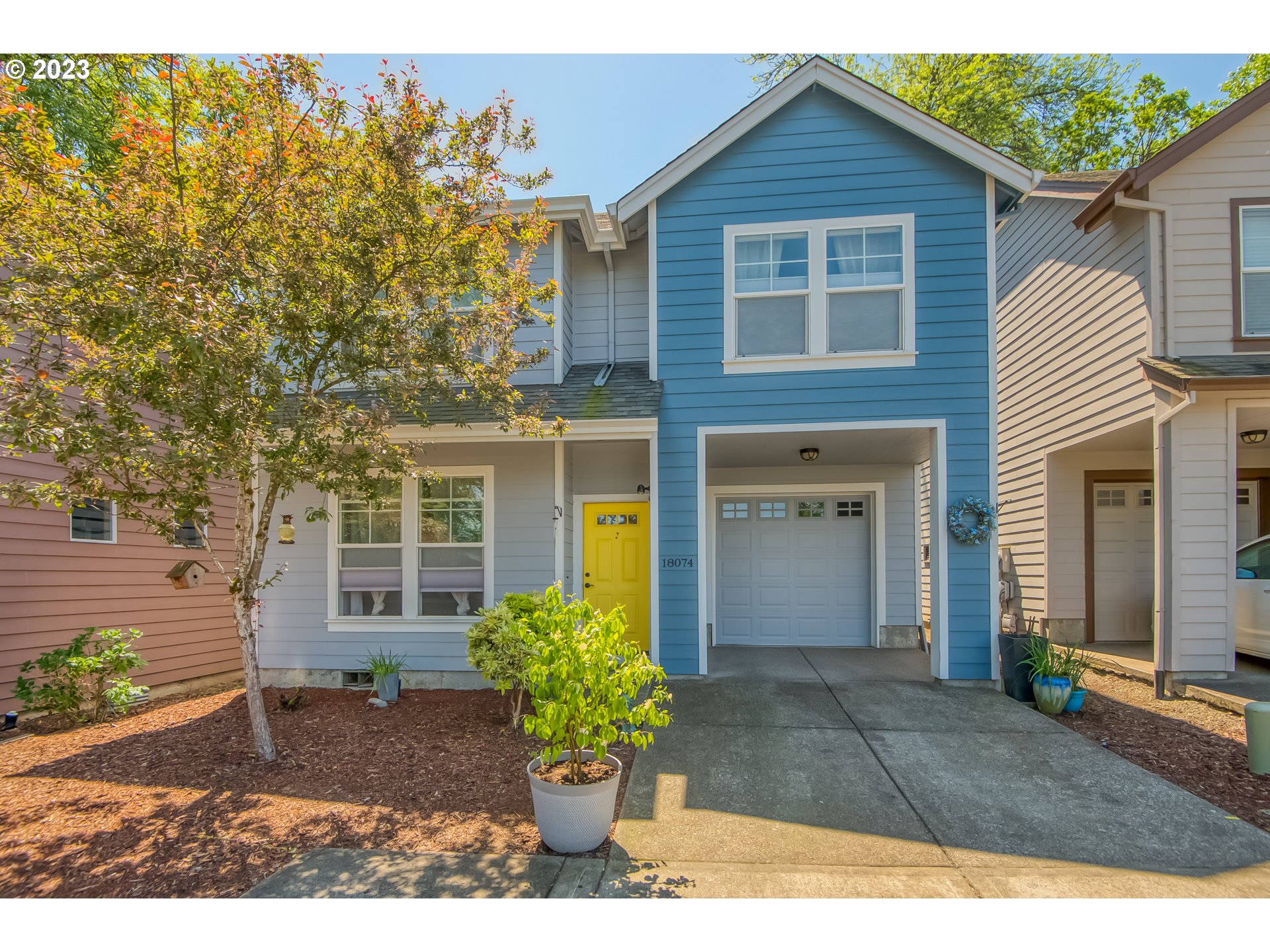 a front view of a house with garden