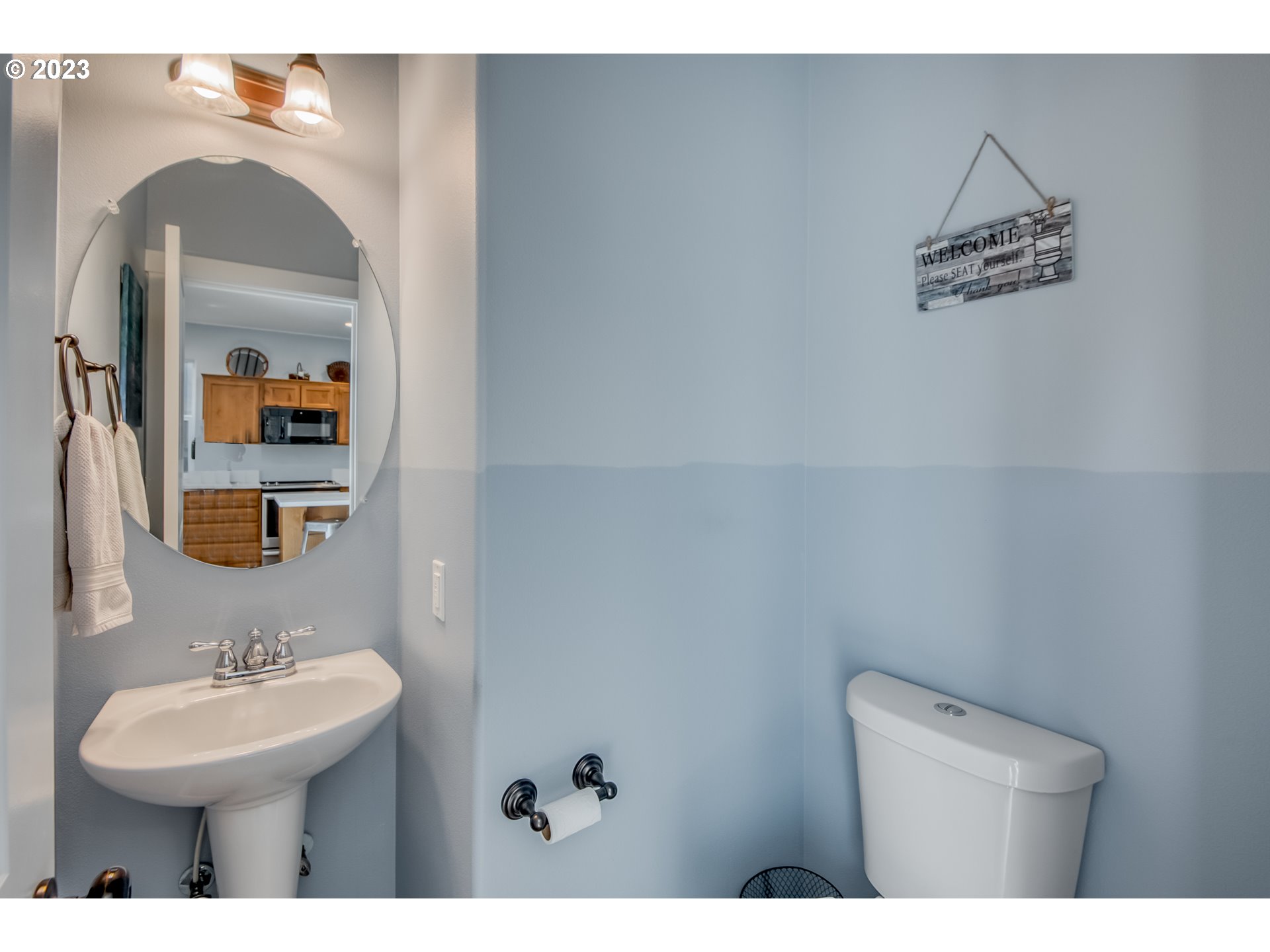 18074 Southwest Lotus Lane Beaverton, OR 97003 - Photo 11 of 19 a bathroom with a toilet sink and mirror