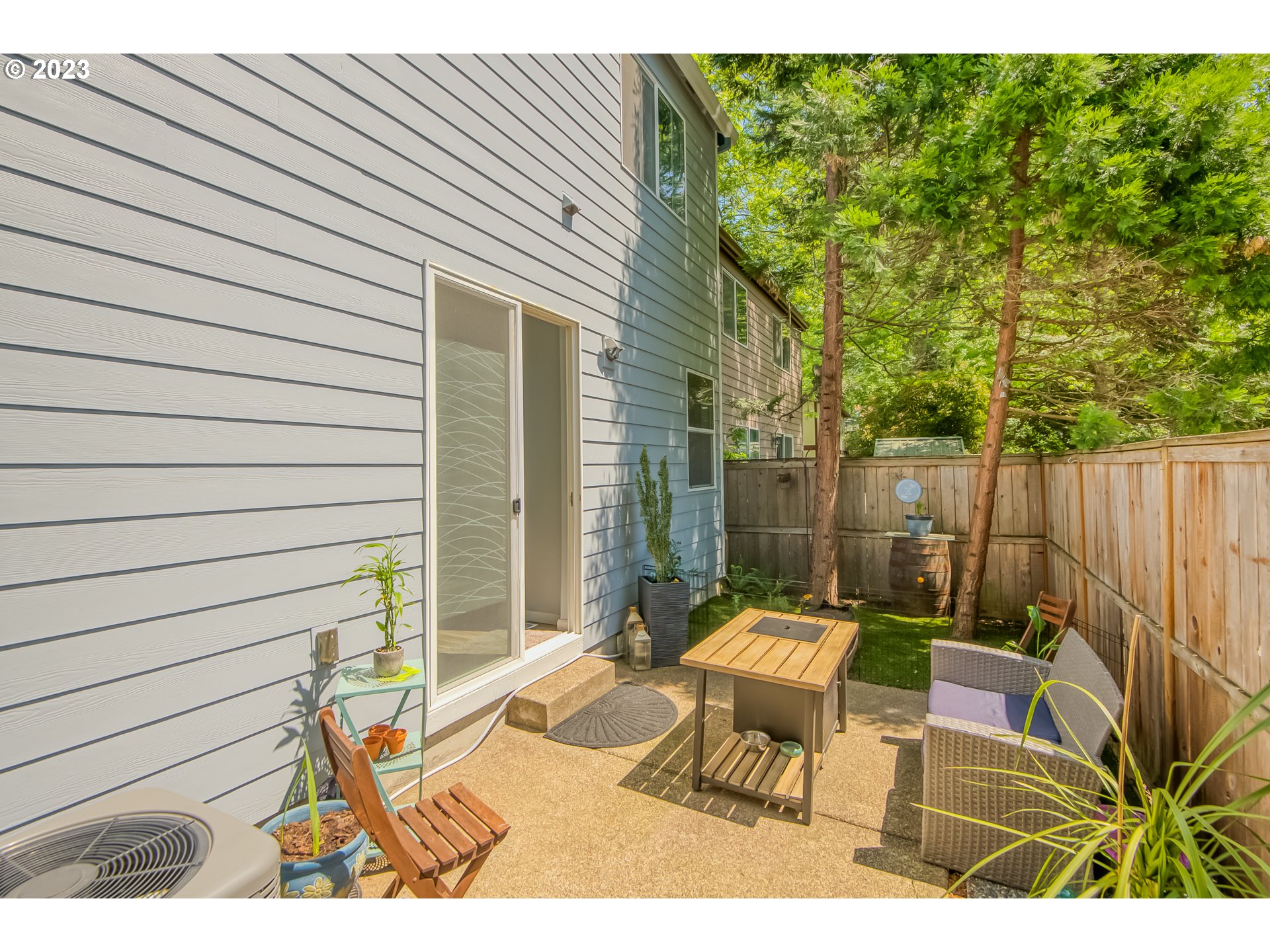 18074 Southwest Lotus Lane Beaverton, OR 97003 - Photo 17 of 19 a view of a patio with a table and chairs