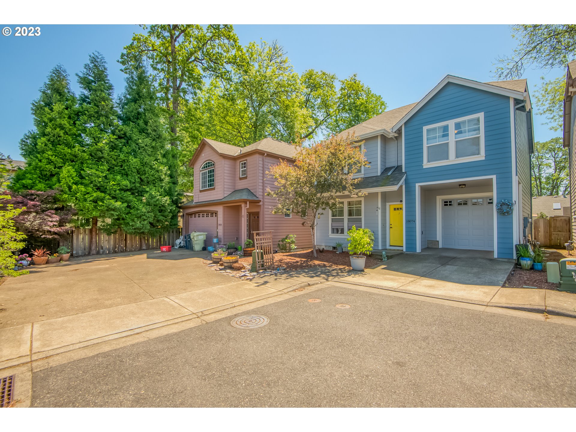 18074 Southwest Lotus Lane Beaverton, OR 97003 - Photo 19 of 19 a front view of a house with a yard and garage