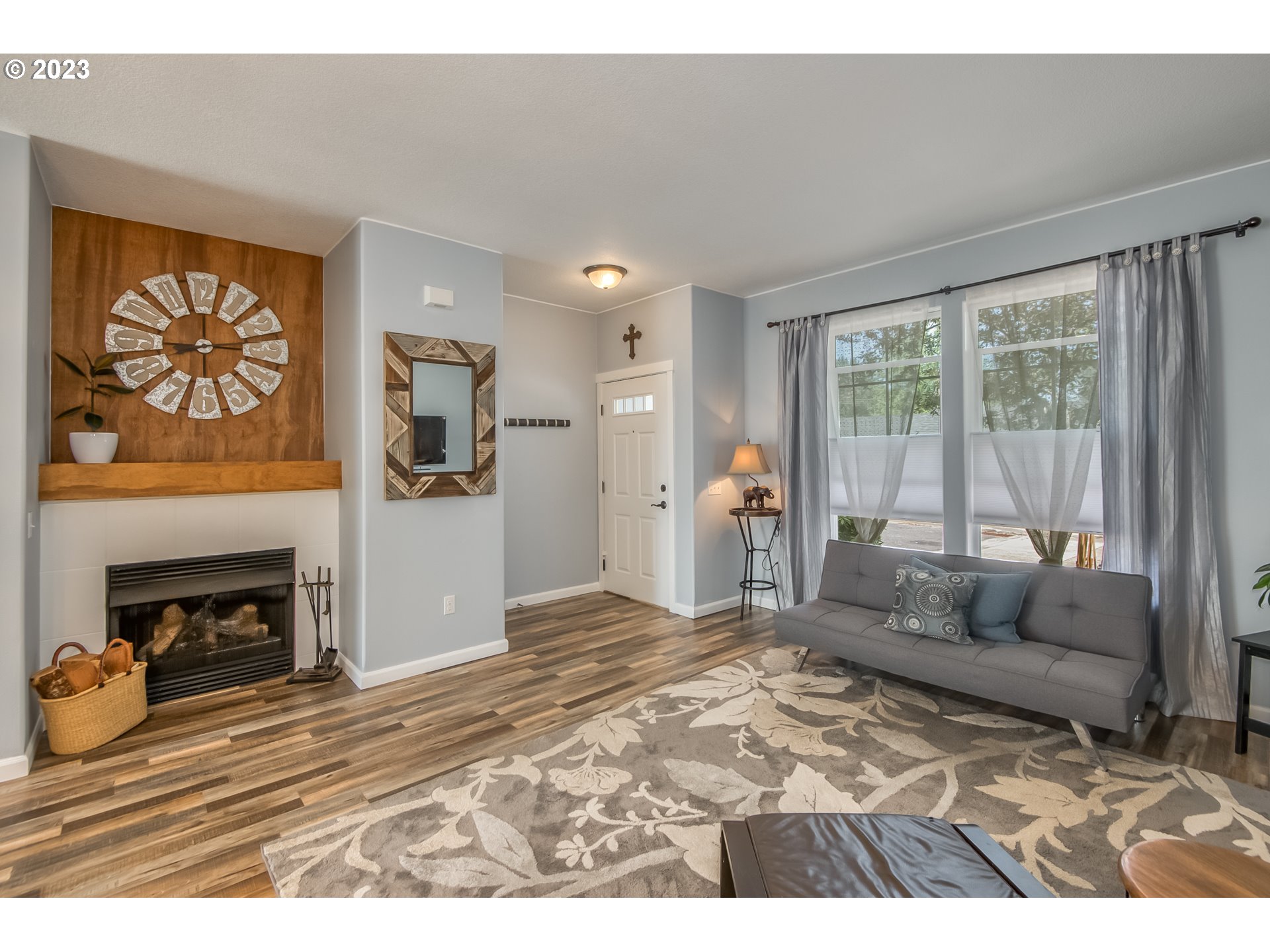 18074 Southwest Lotus Lane Beaverton, OR 97003 - Photo 2 of 19 a living room with furniture and a fireplace