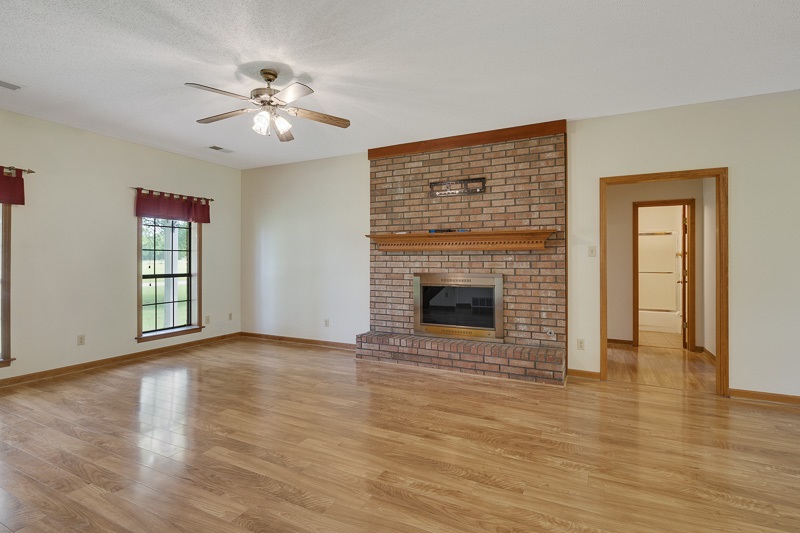 8979 Pleasant Ridge Road Arlington, TN 38002 - Photo 3 of 25 Large, open space for the family to gather. Brick fireplace with gas starter