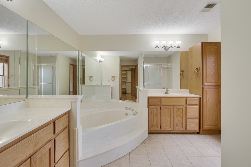 8979 Pleasant Ridge Road Arlington, TN 38002 - Photo 10 of 25 Double vanities, whirlpool tub and separate walk in shower