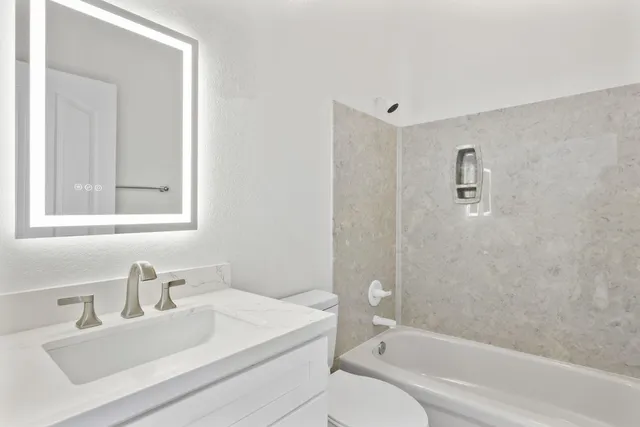 a bathroom with a sink and cabinets