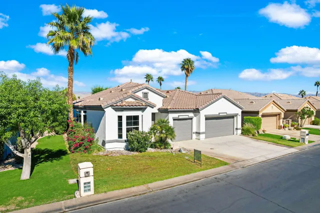 an aerial view of a house with a garden