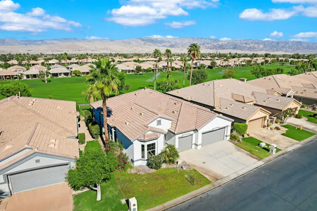 an aerial view of a house with a garden
