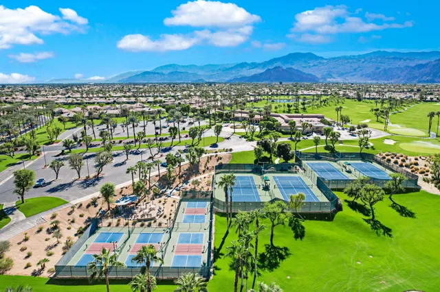 a view of a swimming pool with an outdoor seating